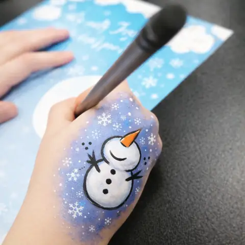 Snowman painted on a hand