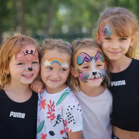 Children with colorful face designs