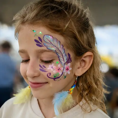Floral butterfly painted on a girl's cheek