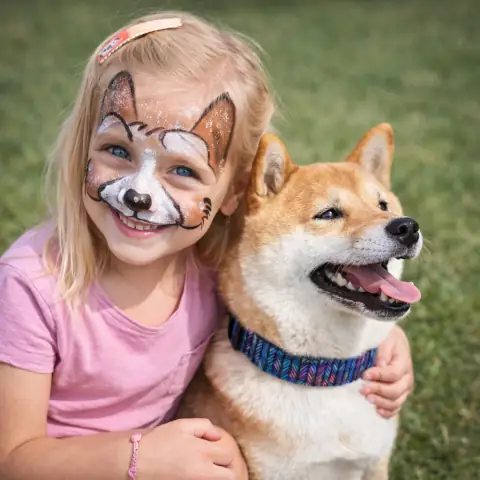 Girl with a dog and face painting