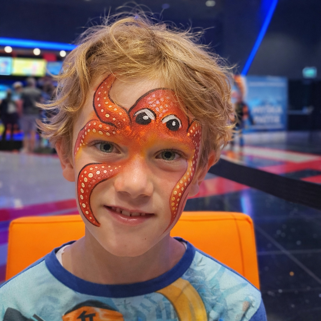 Boy with an octopus painted on his face